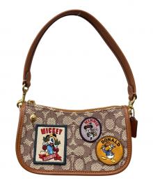 COACH（コーチ）の古着「スウィンガー20・シグネチャーテキスタイルジャカード・パッチ」｜ブラウン