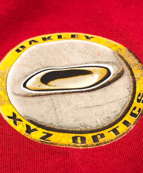 OAKLEY（オークリー）OAKLEY (オークリー) プリントTシャツ レッド サイズ:Mの古着・服飾アイテム