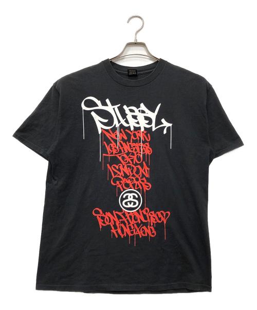 stussy（ステューシー）stussy (ステューシー) GREY PVC ワールドツアーTシャツ ブラック サイズ:Lの古着・服飾アイテム