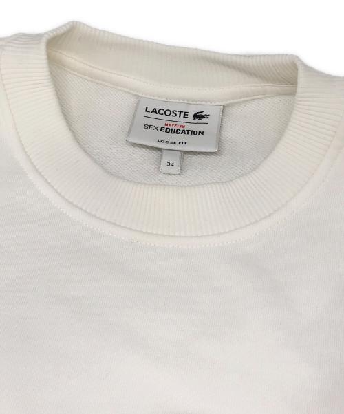 LACOSTE（ラコステ）LACOSTE (ラコステ) NET FLIX (ネットフリックス) アレンジワニロゴクルーネックスウェット ホワイト サイズ:34の古着・服飾アイテム