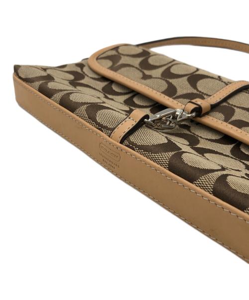 COACH（コーチ）COACH (コーチ) クリップデミ シグネチャーポーチ ベージュの古着・服飾アイテム