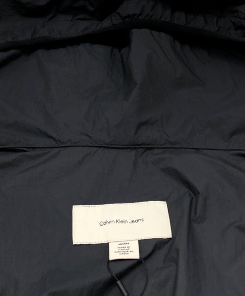 Calvin Klein Jeans（カルバンクラインジーンズ）Calvin Klein Jeans (カルバンクラインジーンズ) ウインドブレーカージャケット グレー サイズ:SIZE Mの古着・服飾アイテム