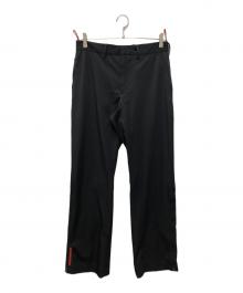 PRADA SPORTS（プラダスポーツ）の古着「ジップスリット ロングトラウザーズパンツ」｜ブラック