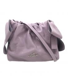 COACH（コーチ）の古着「フェイ ドローストリングバッグ・ボウ」｜パープル