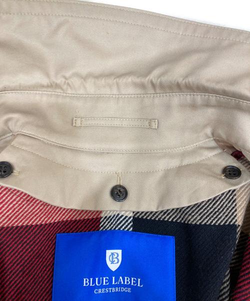 BLUE LABEL CRESTBRIDGE（ブルーレーベルクレストブリッジ）BLUE LABEL CRESTBRIDGE (ブルーレーベルクレストブリッジ) トレンチコート　55A11-200-42 ベージュ サイズ:36の古着・服飾アイテム