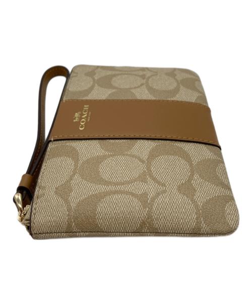 COACH（コーチ）COACH (コーチ) シグネチャーポーチ ベージュ 未使用品の古着・服飾アイテム
