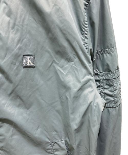 Calvin Klein Jeans（カルバンクラインジーンズ）Calvin Klein Jeans (カルバンクラインジーンズ) ナイロンボンバージャケット グレー サイズ:Sの古着・服飾アイテム