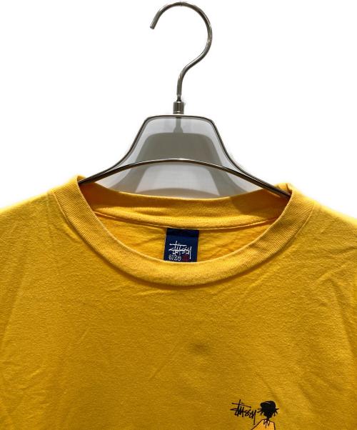 stussy（ステューシー）stussy (ステューシー) シャドーマンプリントTシャツ イエロー サイズ:XLの古着・服飾アイテム