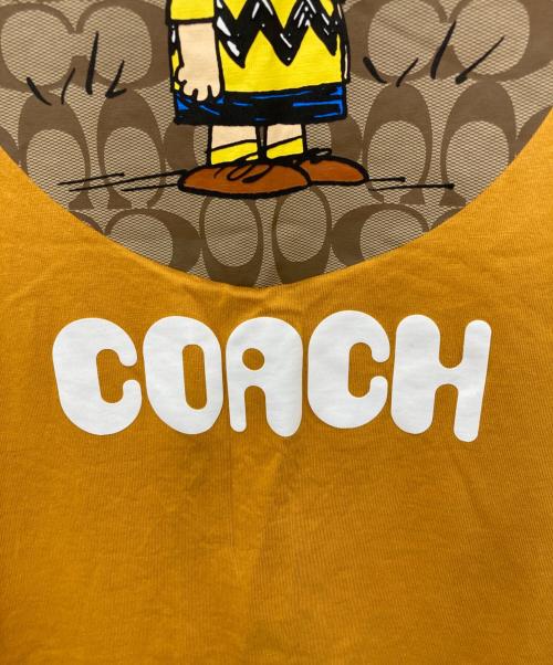 COACH（コーチ）COACH (コーチ) PEANUTS (ピーナッツ) プリントTシャツ イエロー サイズ:Ｍの古着・服飾アイテム