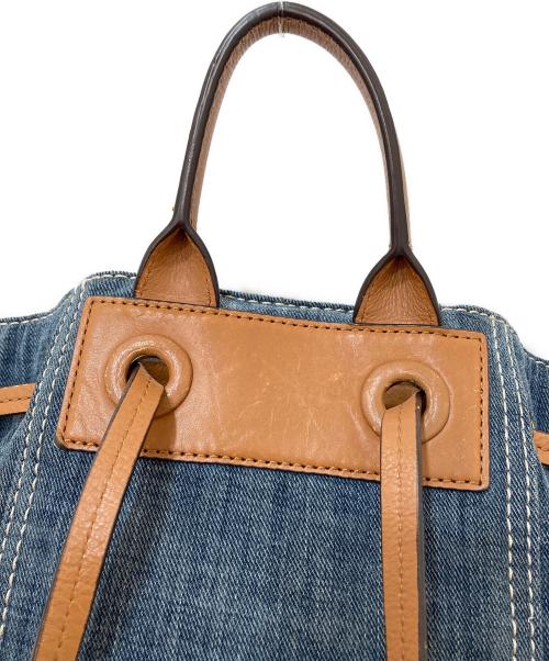 MICHAEL KORS（マイケルコース）MICHAEL KORS (マイケルコース) デニム レザー 巾着リュックサック インディゴの古着・服飾アイテム