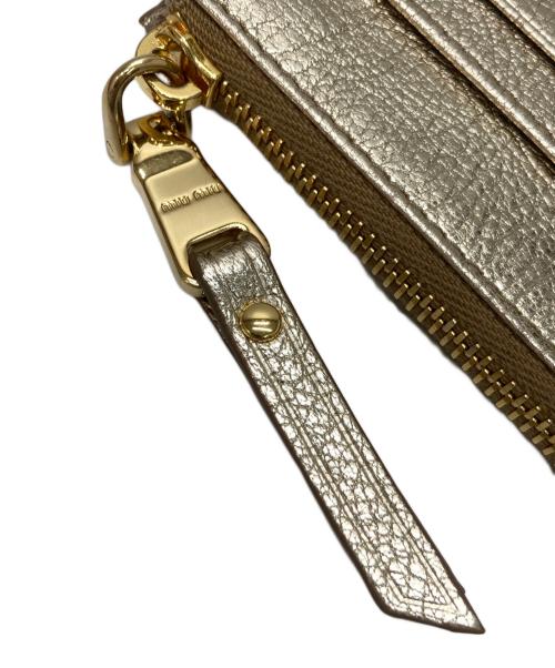 MIU MIU（ミュウミュウ）MIU MIU (ミュウミュウ) 財布 ゴールドの古着・服飾アイテム