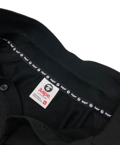 Aape BY A BATHING APE（エーエイプ バイ アベイシングエイプ）Aape BY A BATHING APE (エーエイプ バイ アベイシングエイプ) ポロシャツ ブラック サイズ:Mの古着・服飾アイテム