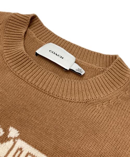 COACH（コーチ）COACH (コーチ) ホース アンド キャリッジ クルーネック セーター ベージュ サイズ:Sの古着・服飾アイテム