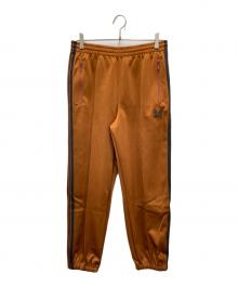 Needles（ニードルズ）の古着「ジョガートラックパンツ」｜オレンジ