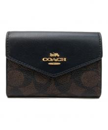 COACH（コーチ）の古着「フラップ カード ケース・シグネチャー キャンバス」｜ブラウン