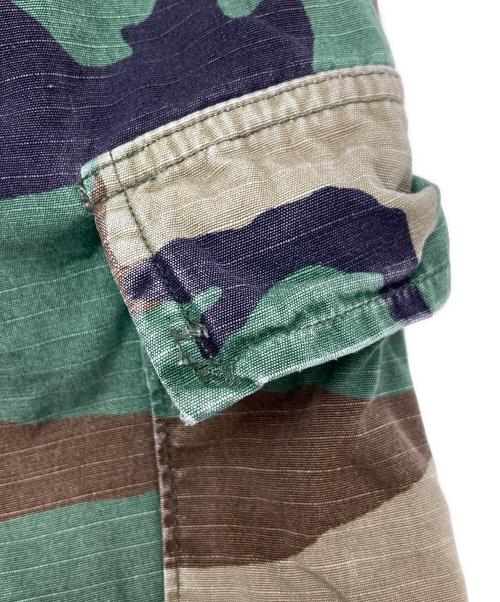 JOSHUA JAMAL（ジョシュア ジャマル）JOSHUA JAMAL (ジョシュア ジャマル) 迷彩 ダメージ 加工 カットオフハーフパンツ オリーブ サイズ:Lの古着・服飾アイテム