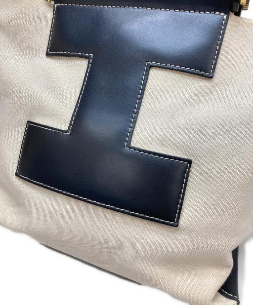 IACUCCI（イアクッチ）IACUCCI (イアクッチ) キャンパスレザーハンドバッグ アイボリー×ブラックの古着・服飾アイテム
