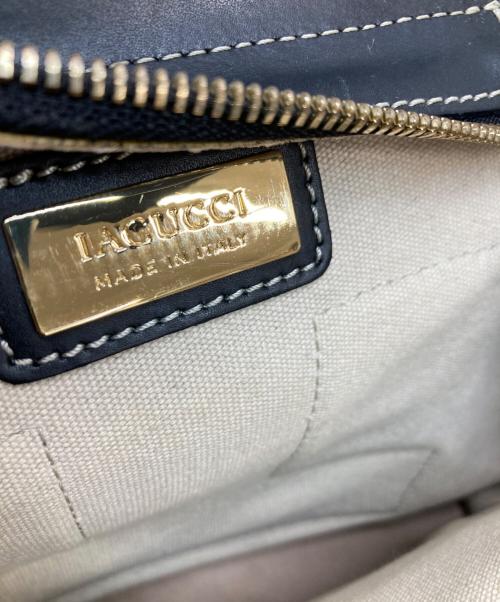 IACUCCI（イアクッチ）IACUCCI (イアクッチ) キャンパスレザーハンドバッグ アイボリー×ブラックの古着・服飾アイテム