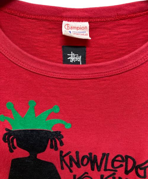 Champion（チャンピオン）Champion (チャンピオン) stussy (ステューシー) フロッキーシャドーマンTシャツ レッド サイズ:Lの古着・服飾アイテム