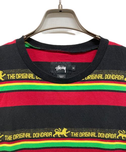 stussy（ステューシー）stussy (ステューシー) ラスタカラーボーダーTシャツ ブラック サイズ:Ｍの古着・服飾アイテム