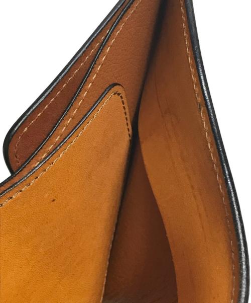 WILDSWANS（ワイルドスワンズ）WILDSWANS (ワイルドスワンズ) 小銭入れ付2つ折り財布GROUNDER ブラウンの古着・服飾アイテム