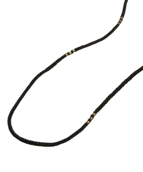 M.Cohen（エム・コーエン）M.Cohen (エム・コーエン) レザー×ボタンネックレス ブラック×ゴールドの古着・服飾アイテム