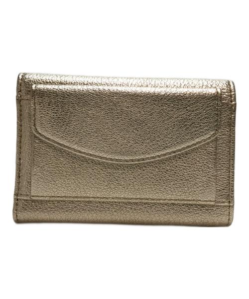 ANYA HINDMARCH（アニヤ・ハインドマーチ）ANYA HINDMARCH (アニヤ・ハインドマーチ) ミニトライフォールドウォレット シルバーの古着・服飾アイテム