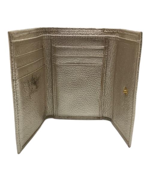 ANYA HINDMARCH（アニヤ・ハインドマーチ）ANYA HINDMARCH (アニヤ・ハインドマーチ) ミニトライフォールドウォレット シルバーの古着・服飾アイテム