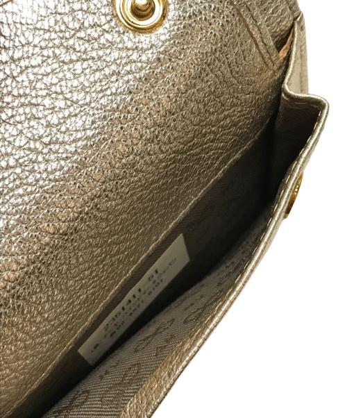 ANYA HINDMARCH（アニヤ・ハインドマーチ）ANYA HINDMARCH (アニヤ・ハインドマーチ) ミニトライフォールドウォレット シルバーの古着・服飾アイテム