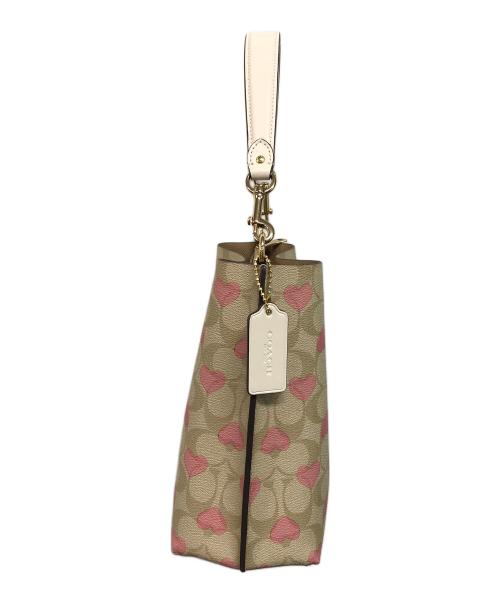 COACH（コーチ）COACH (コーチ) モリーバケットバッグ22 ベージュ×ピンクの古着・服飾アイテム