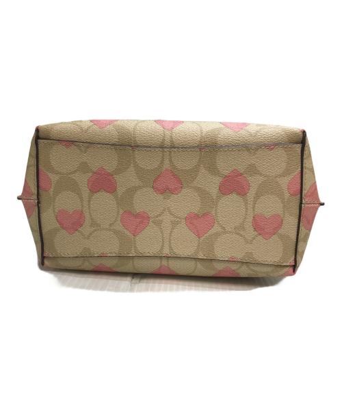 COACH（コーチ）COACH (コーチ) モリーバケットバッグ22 ベージュ×ピンクの古着・服飾アイテム