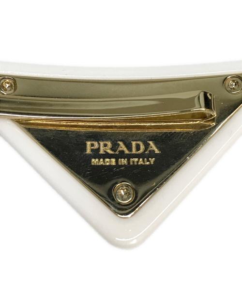 PRADA（プラダ）PRADA (プラダ) 三角ロゴ花柄ヘアバレッタ ホワイト×ゴールドの古着・服飾アイテム