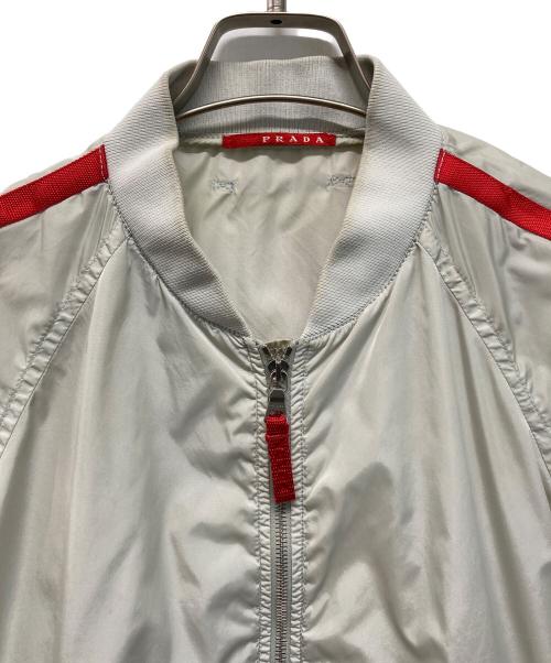 PRADA SPORTS（プラダスポーツ）PRADA SPORTS (プラダスポーツ) 00’Sナイロンジャケット　サイドロゴ ベージュ×レッド サイズ:Lの古着・服飾アイテム