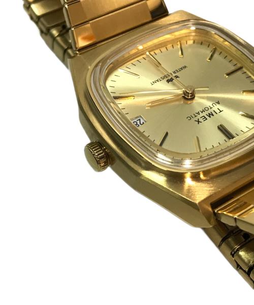 TIMEX（タイメックス）TIMEX (タイメックス) 1983 E-Line 復刻モデル ゴールドの古着・服飾アイテム