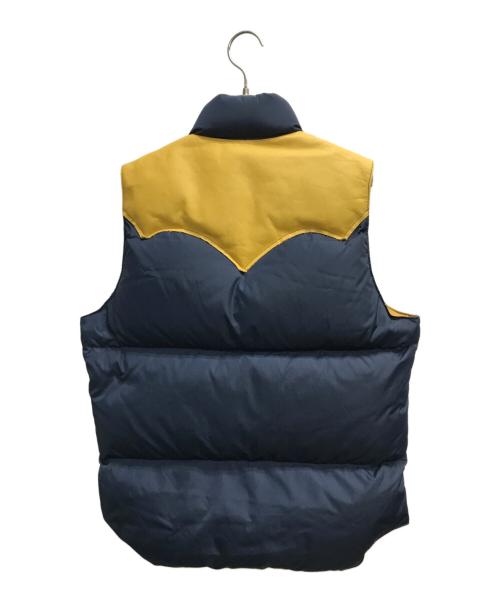 Rocky Mountain FeatherBed（ロッキーマウンテンフェザーベッド）Rocky Mountain FeatherBed (ロッキーマウンテンフェザーベッド) DOWN VEST(ダウンベスト) ネイビー×イエロー サイズ:38の古着・服飾アイテム