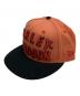 New Era（ニューエラ）の古着「キャップ」｜オレンジ