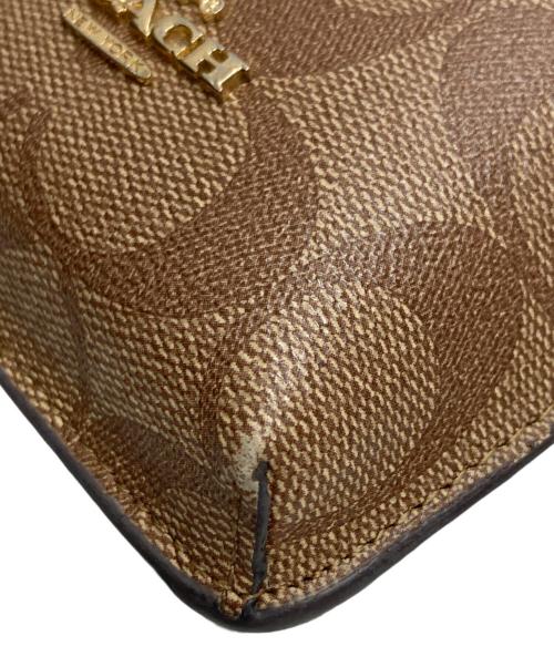 COACH（コーチ）COACH (コーチ) ノース／サウス フォーン クロスボディ シグネチャー キャンバス ブラウンの古着・服飾アイテム