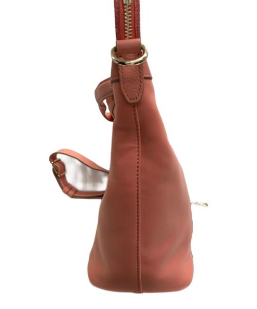 COLE HAAN（コールハーン）COLE HAAN (コールハーン) グランド アンビション ネオプレン ソフト サッチェル バーント コーラルの古着・服飾アイテム