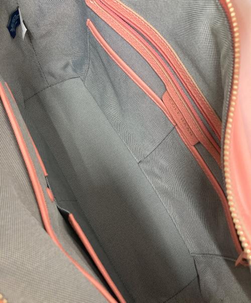 COLE HAAN（コールハーン）COLE HAAN (コールハーン) グランド アンビション ネオプレン ソフト サッチェル バーント コーラルの古着・服飾アイテム