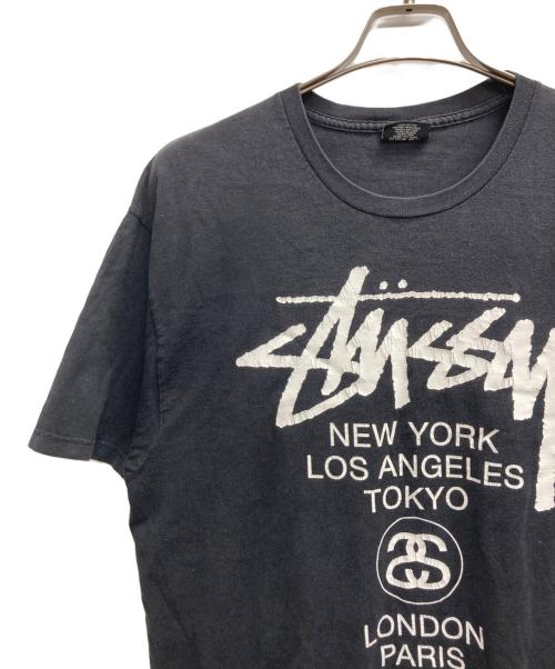 stussy（ステューシー）stussy (ステューシー) WORLD TOUR TEE ブラック サイズ:Lの古着・服飾アイテム