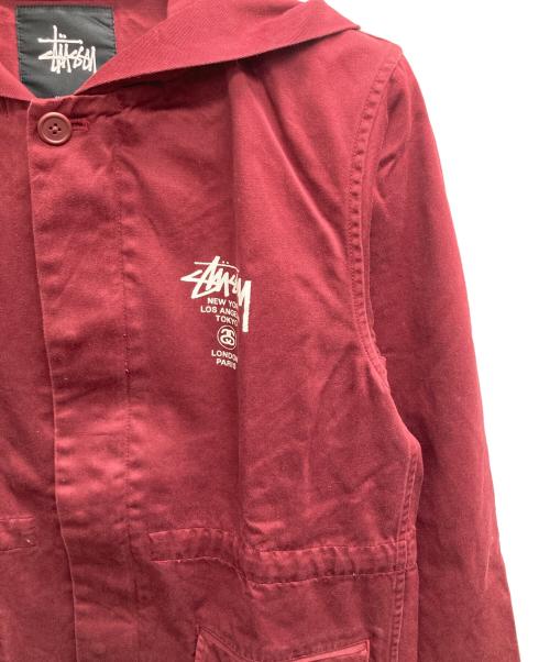 stussy（ステューシー）stussy (ステューシー) ワールドツアーフーデットカバーオール ボルドー サイズ:Mの古着・服飾アイテム