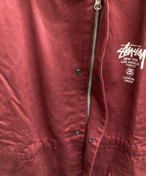 stussy（ステューシー）stussy (ステューシー) ワールドツアーフーデットカバーオール ボルドー サイズ:Mの古着・服飾アイテム