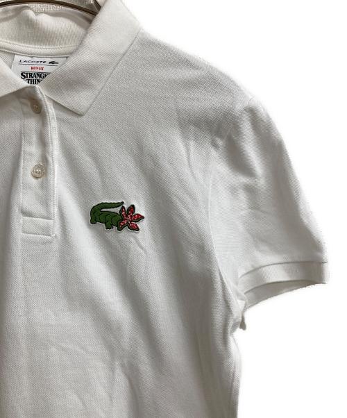 LACOSTE（ラコステ）LACOSTE (ラコステ) STRANGER THINGS (ストレンジャーシングス) ポロシャツ ホワイト サイズ:34の古着・服飾アイテム