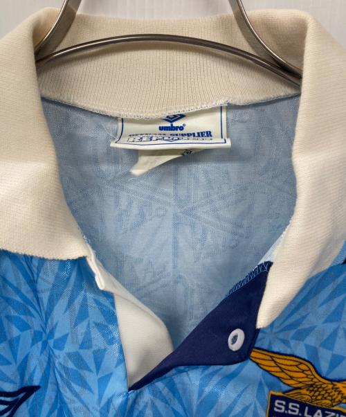 UMBRO（アンブロ）UMBRO (アンブロ) S.S. LAZIOゲームシャツ スカイブルー サイズ:Lの古着・服飾アイテム