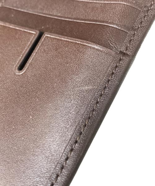 TUMI（トゥミ）TUMI (トゥミ) 二つ折長財布 ブラウンの古着・服飾アイテム