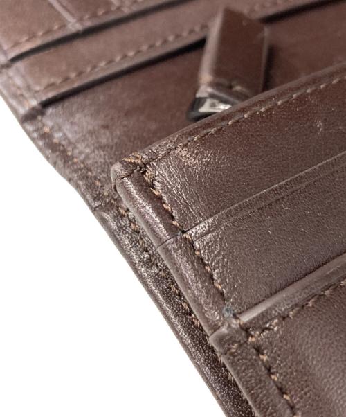 TUMI（トゥミ）TUMI (トゥミ) 二つ折長財布 ブラウンの古着・服飾アイテム