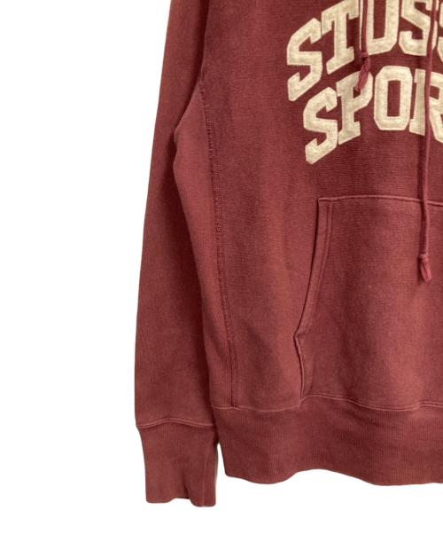stussy（ステューシー）stussy (ステューシー) Champion (チャンピオン) アーチロゴパーカー レッド サイズ:Mの古着・服飾アイテム
