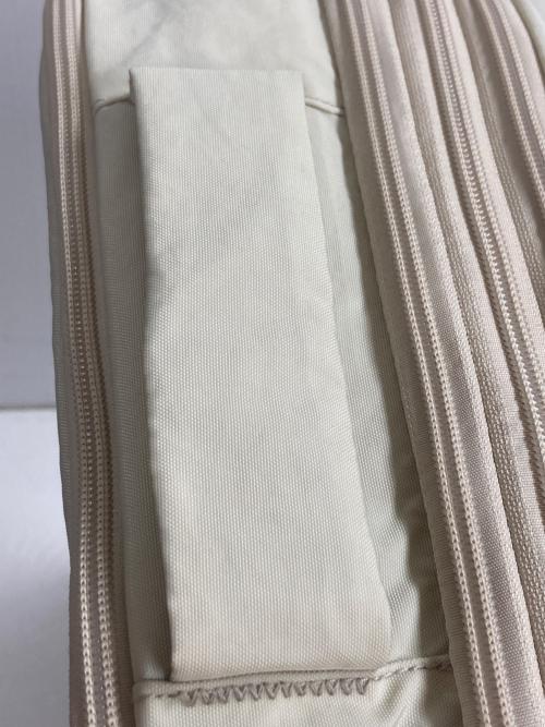 AWW（アウ）Aww (アウ) 圧縮トラベルバックパック アイボリーの古着・服飾アイテム