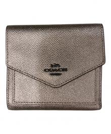 COACH（コーチ）の古着「2つ折り財布」｜ブロンズ