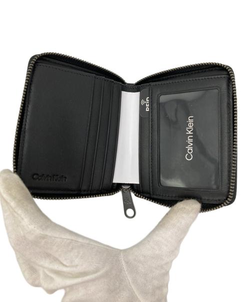 Calvin Klein（カルバンクライン）Calvin Klein (カルバンクライン) ラウンドジップウォレット ブラックの古着・服飾アイテム